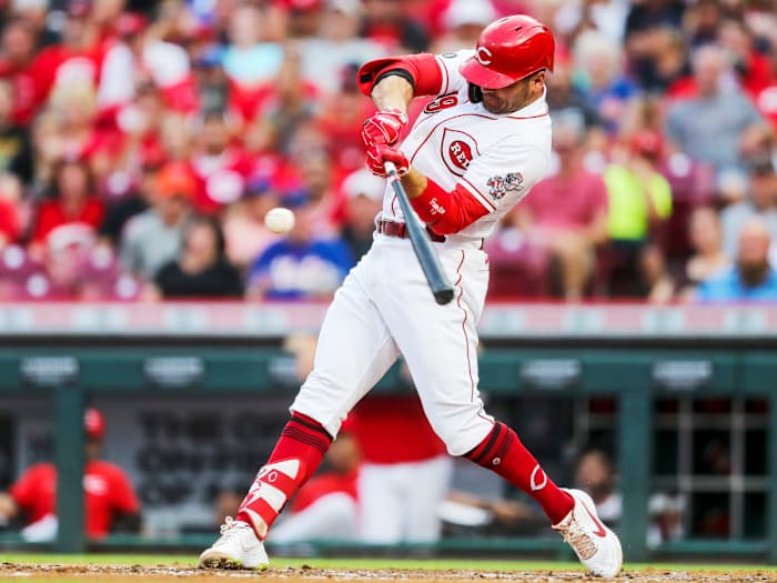 Jul 20, 2021; Cincinnati, Ohio, USA; Cincinnati Reds first baseman Joey Votto (19) hits a solo home run against the New York Mets in the third inning at Great American Ball Park.